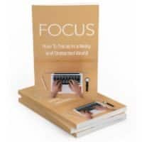 Book titled "FOCUS" with visible hands typing on a laptop.
